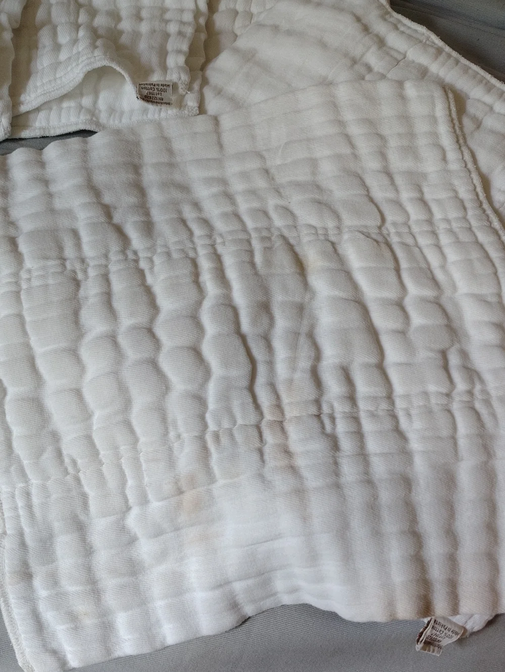Twelve Clotheez Wide Baby 100 percent Cotton Reusable Prefold Diapers.